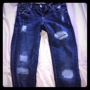 Jeans Garage with holes